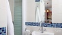 Seville Apartment - Bathroom with shower, toilet and washbasin.
