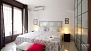 Seville Apartment - Bedroom with twin beds placed together.