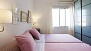 Seville Apartment - Bedroom 2 also has twin beds and a wardrobe.