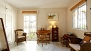 Seville Apartment - The master bedroom has its own seating area with desk and chairs (upper level).