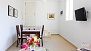 Seville Apartment - Dining table with chairs.