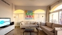 Seville Apartment - The living room is infused with light from the sunrise.