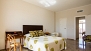 Seville Apartment - Other view of the master bedroom. The door closed opens to a dressing room.