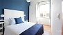 Seville Apartment - Master bedroom with a double bed (1.50 x 2.00 m) and a wardrobe.