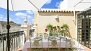 Seville Apartment - Terrace furnished with a large dining table and chairs - ideal to enjoy a meal outside.