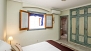 Seville Apartment - Bedroom No.1 has a double bed and an en-suite bathroom. The window faces a quiet inner patio.